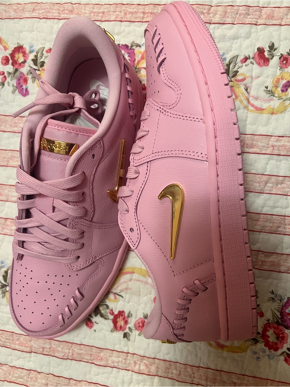 Nike Pink Low-Top Sneakers with Gold Swoosh